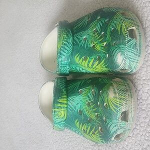 Leaf print Crocs size 9. See signs of wear in big toe area in last picture